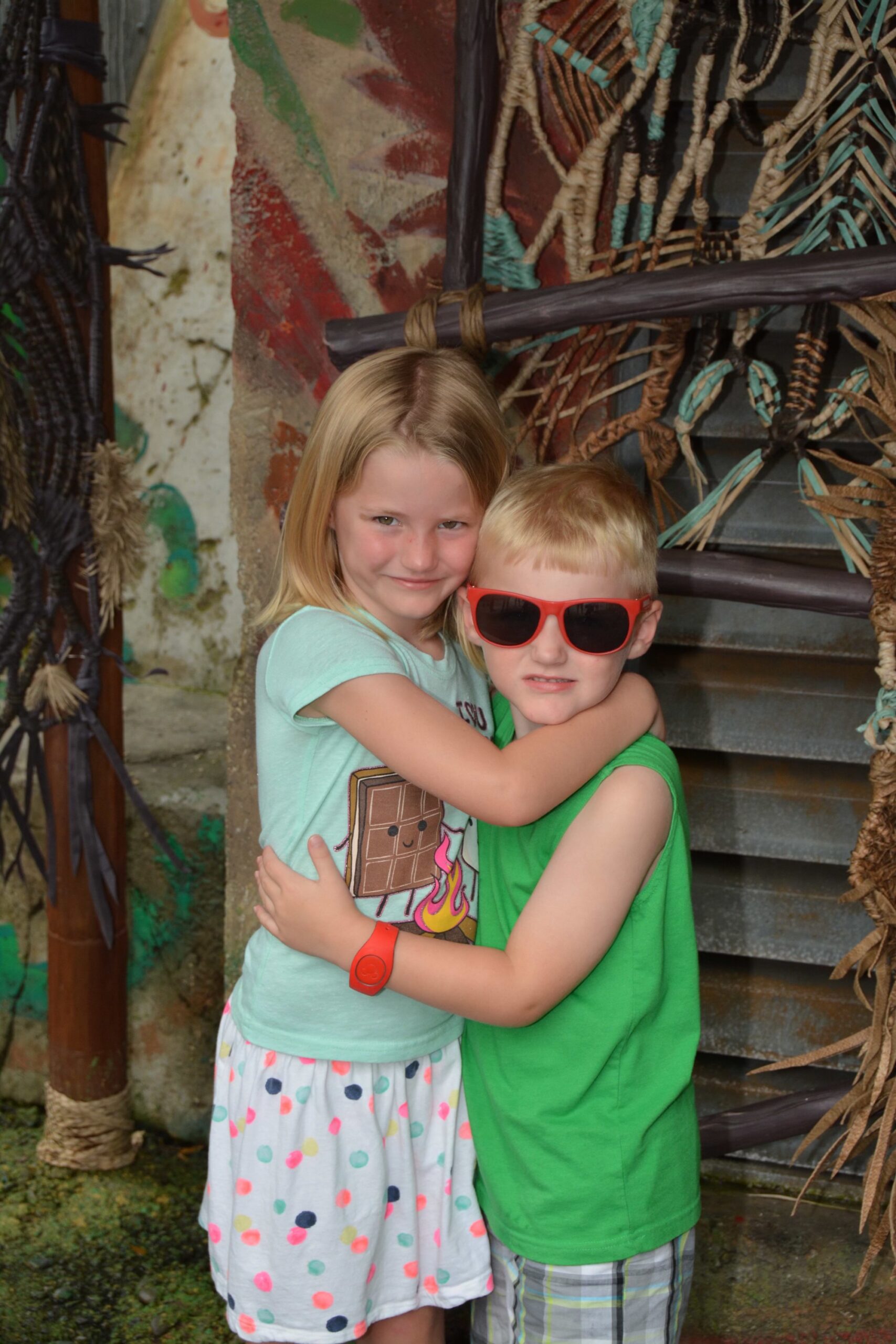 little boy and girl hugging